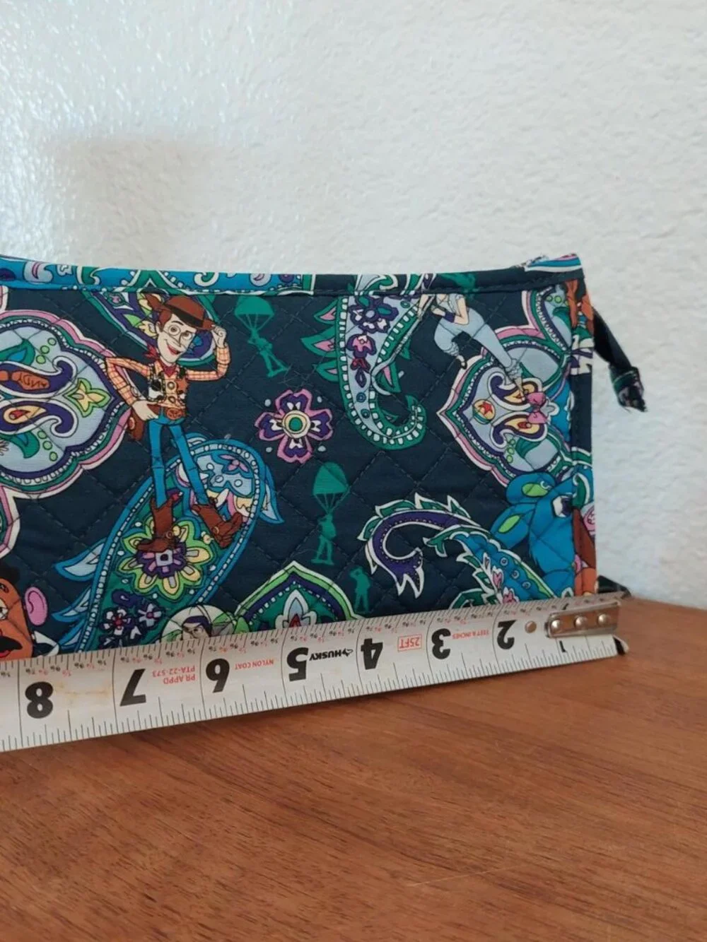 vera bradley Disney Toy Story quilted pouch with characters in a paisley design